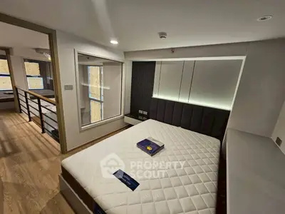 Modern bedroom with sleek design and large window in stylish apartment