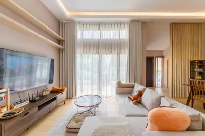 Spacious modern living room with large windows and stylish decor
