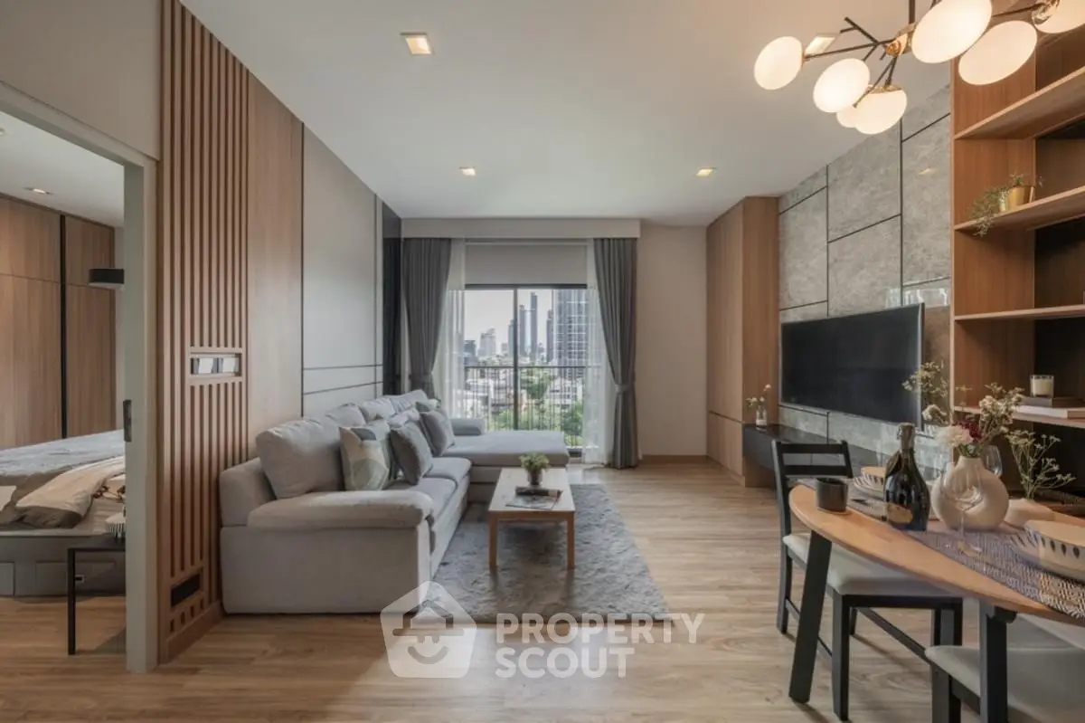 Modern living room with city view, stylish decor, and open layout in a luxury apartment.