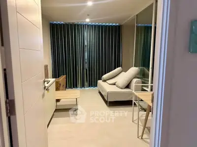 Modern living room with cozy sofa and stylish decor, perfect for relaxation and entertainment.