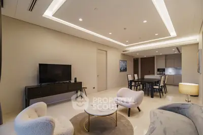 Luxurious modern living room with elegant furniture and open kitchen layout