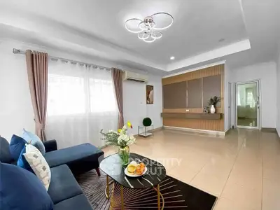 Spacious modern living room with elegant decor and natural light