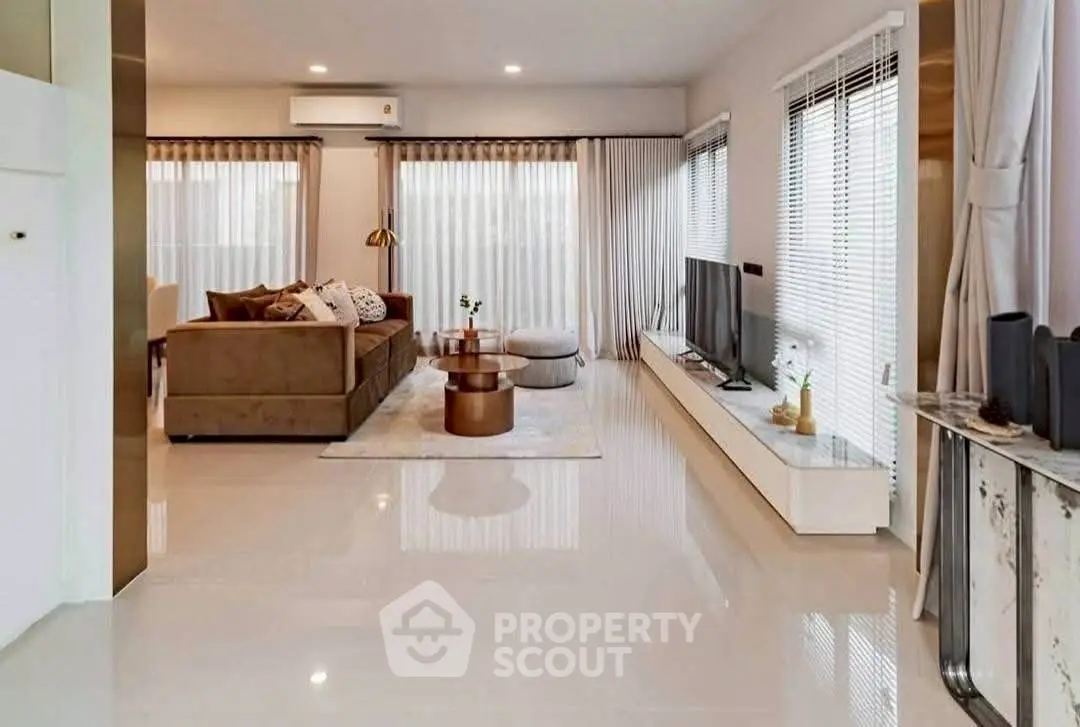 Spacious modern living room with sleek design and abundant natural light