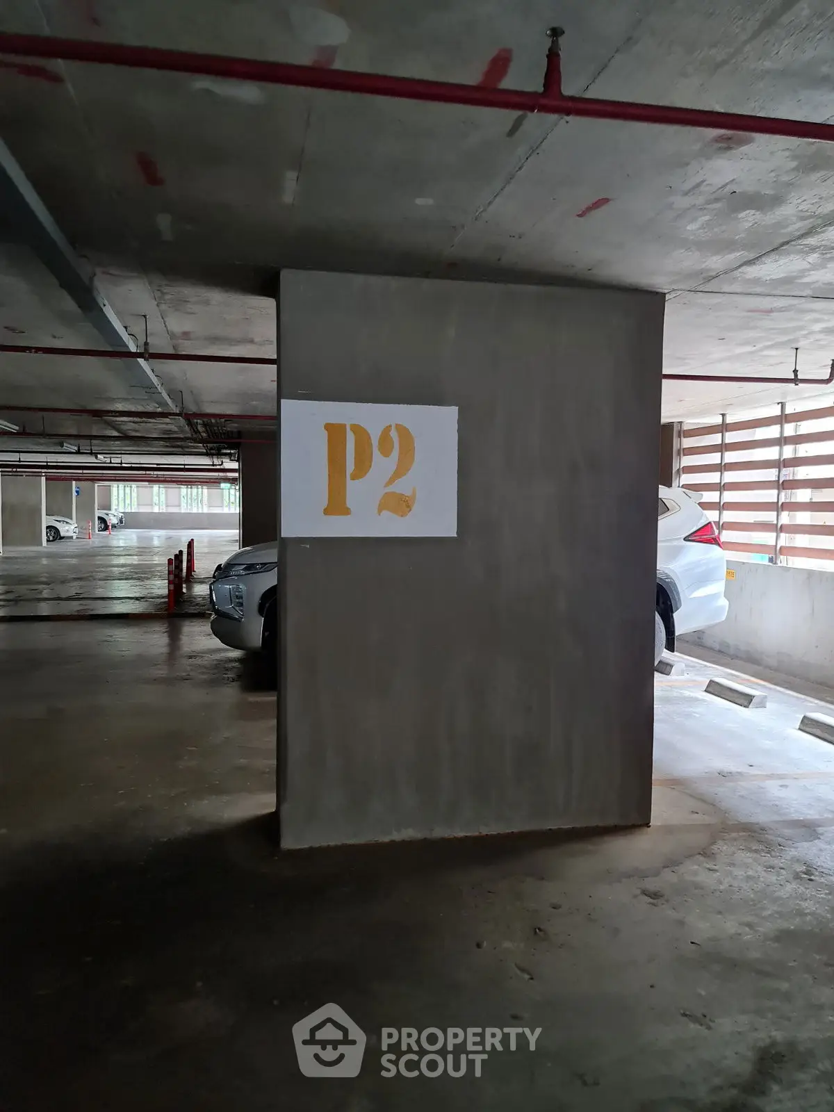 Spacious underground parking area with ample lighting and clear signage