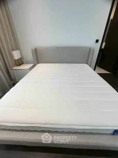 Modern bedroom with stylish bed and elegant decor, perfect for a cozy and comfortable living space.