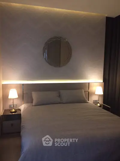 Modern bedroom with elegant lighting and stylish decor