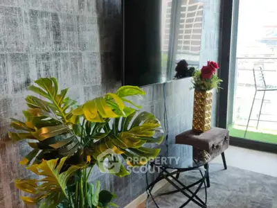 Stylish living room with modern decor and balcony view