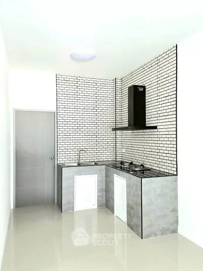 Modern minimalist kitchen with sleek design and gas stove