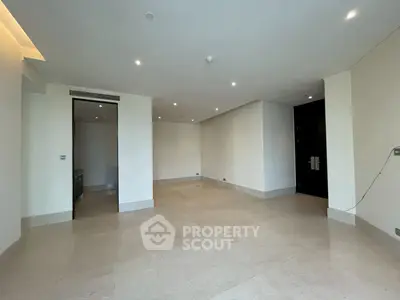 Spacious empty living room with modern lighting and marble flooring