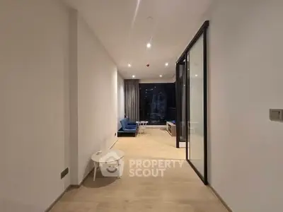 Spacious modern living room with sleek design and cozy seating area, perfect for relaxation and entertainment.