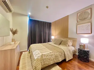 Cozy and stylish bedroom with modern decor and warm lighting, perfect for relaxation.