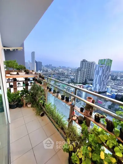 Stunning balcony with lush greenery and panoramic city view, perfect for urban living enthusiasts.