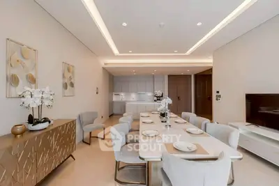 Luxurious dining area with elegant decor and modern lighting in a spacious apartment.