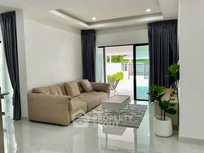 Spacious modern living room with elegant decor and garden view