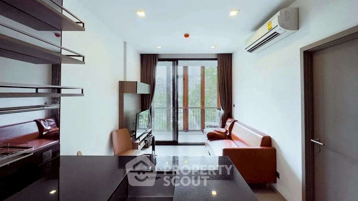 Modern living room with sleek design and balcony view