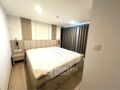 Modern bedroom with stylish headboard and natural light