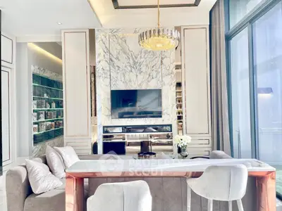 Luxurious living room with marble accents and elegant chandelier