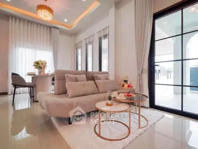 Elegant living room with modern decor and large windows, featuring a cozy sofa and stylish coffee tables.