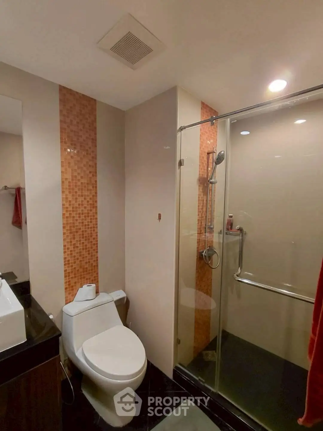 Modern bathroom with glass shower and stylish fixtures