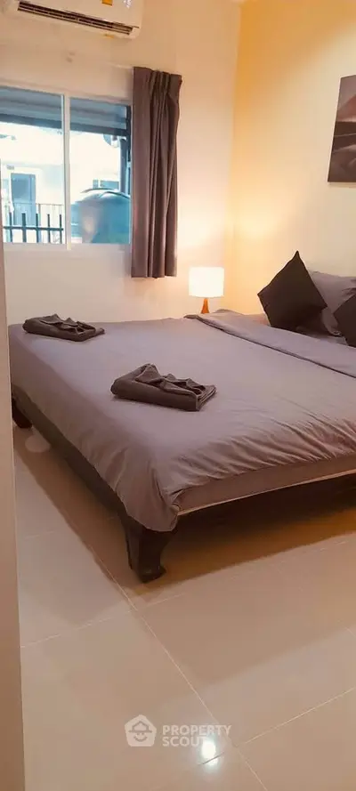 Cozy bedroom with modern decor and natural light