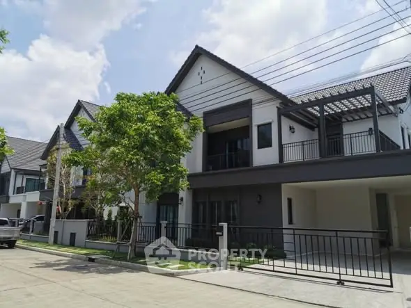 Modern two-story house with sleek design and spacious driveway
