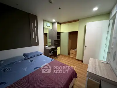 Modern bedroom with stylish decor and ample storage space