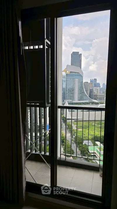 Stunning cityscape view from a modern apartment balcony, showcasing urban skyline and lush greenery.