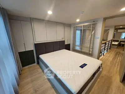 Spacious modern bedroom with elegant design and ample natural light