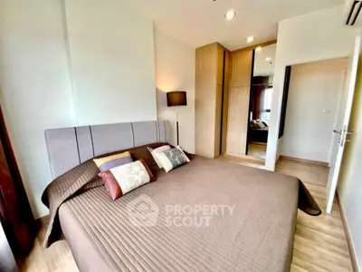 Modern bedroom with stylish decor and ample natural light