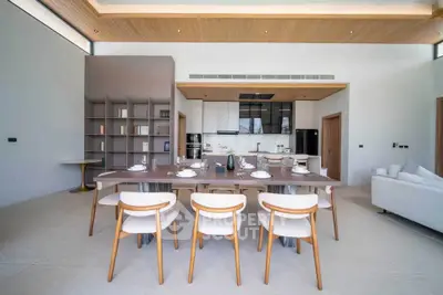 Luxurious open-plan living and dining area with modern furnishings and elegant design.