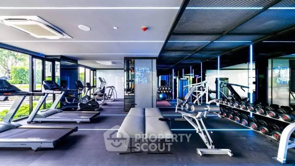 Modern gym with state-of-the-art equipment and sleek design, perfect for fitness enthusiasts.