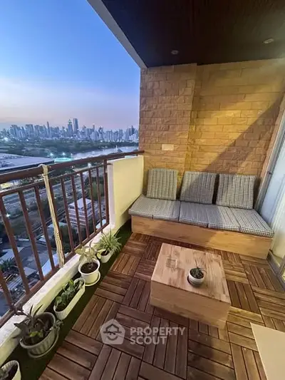 Charming balcony with city skyline view, cozy seating, and wooden flooring.