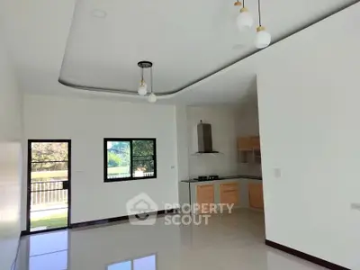 Spacious modern kitchen with open layout and sleek design in a bright, airy home.