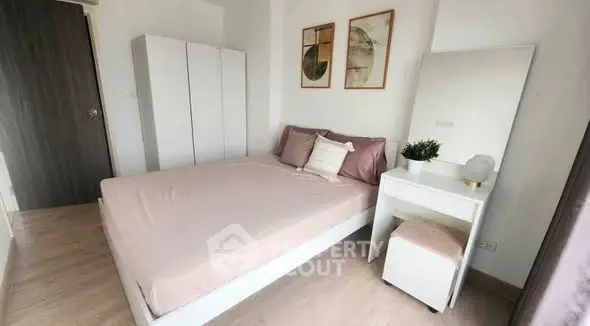 Cozy bedroom with modern decor and ample storage in stylish apartment