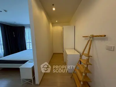 Spacious bedroom with modern minimalist design and ample natural light