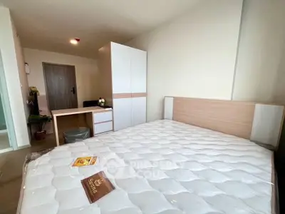 Modern bedroom with stylish furniture and natural light, perfect for comfortable living.