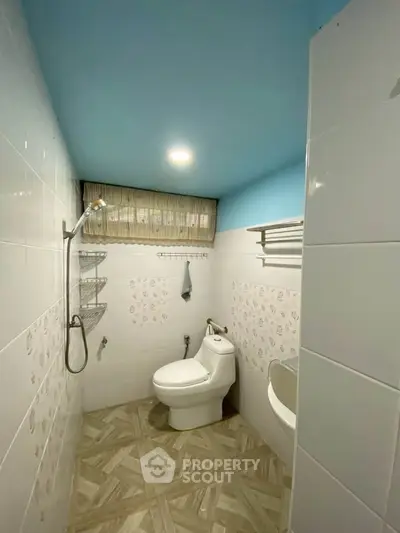 Modern bathroom with sleek fixtures and stylish tile flooring