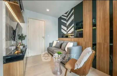 Modern living room with stylish decor and cozy seating area, featuring elegant wood paneling and contemporary design.