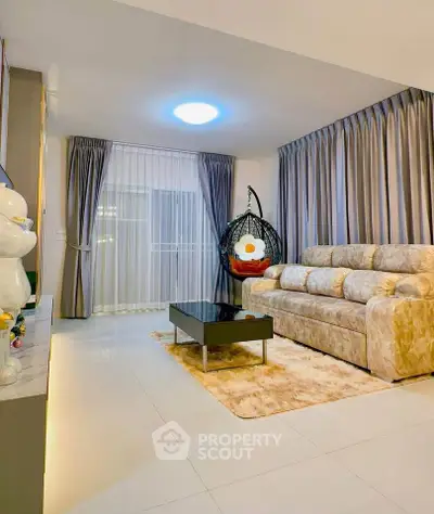 Luxurious living room with plush sofa and modern decor in elegant apartment.