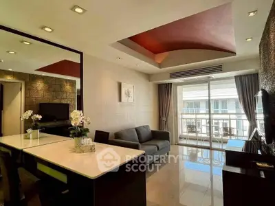 Modern living room with stylish ceiling design and balcony view in luxury apartment.