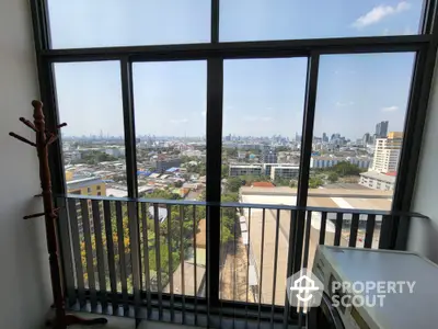 Stunning high-rise apartment view with cityscape and laundry area