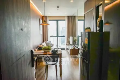 Modern living room with dining area and city view, featuring sleek design and natural light.