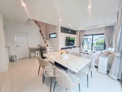 Spacious modern living room with elegant dining area and stylish decor