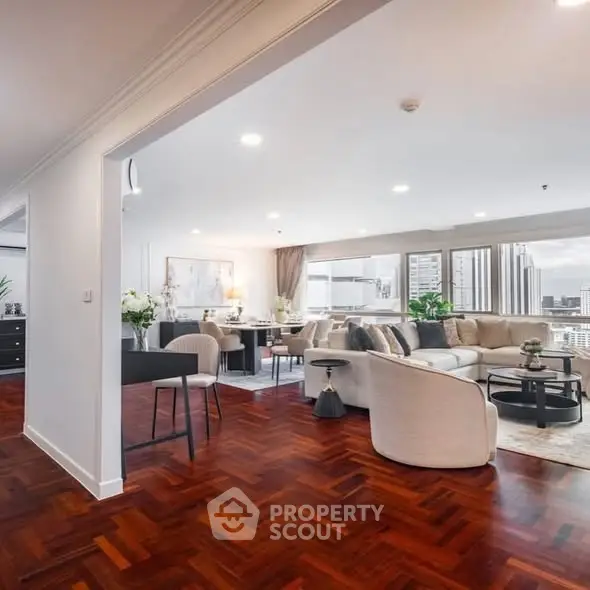 Spacious modern living room with city view and elegant decor