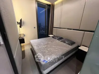 Modern bedroom with floor-to-ceiling windows and sleek design