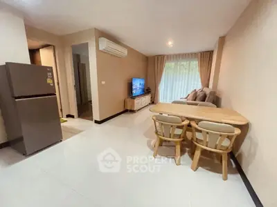 Spacious living room with modern furniture and natural light.