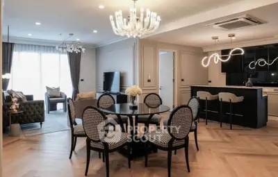 Luxurious open-plan living and dining area with elegant decor and modern lighting