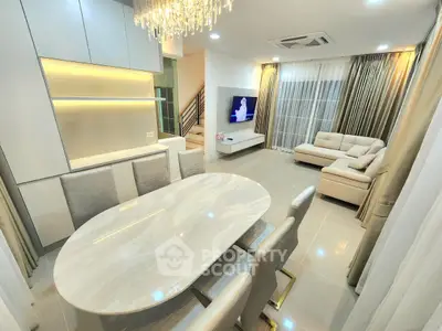 Luxurious modern living room with elegant dining area and stylish lighting