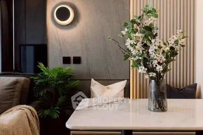 Elegant modern living room with stylish decor and marble table, perfect for sophisticated urban living.