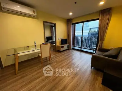 Spacious living room with balcony view in modern apartment